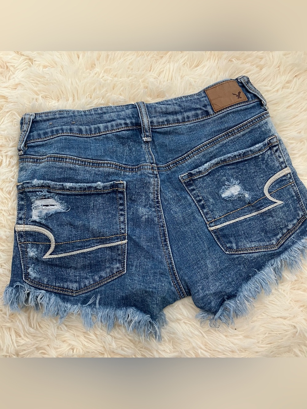 American Eagle Denim Distressed Mid Rise Mini Shorts - Picture 3 of 10
